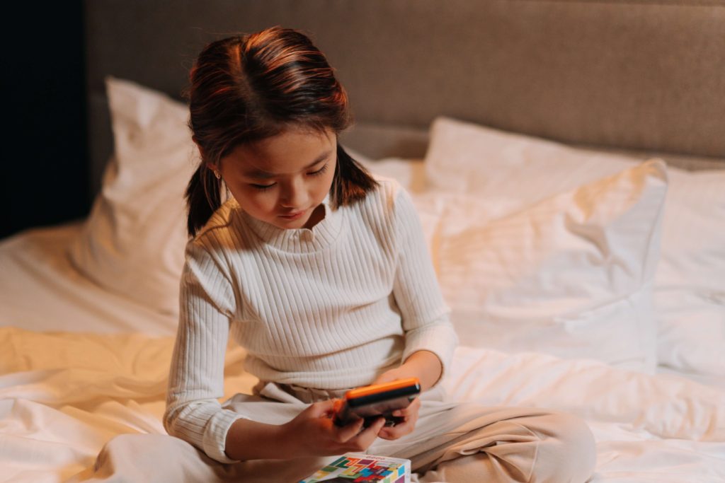 young girl using smartphone